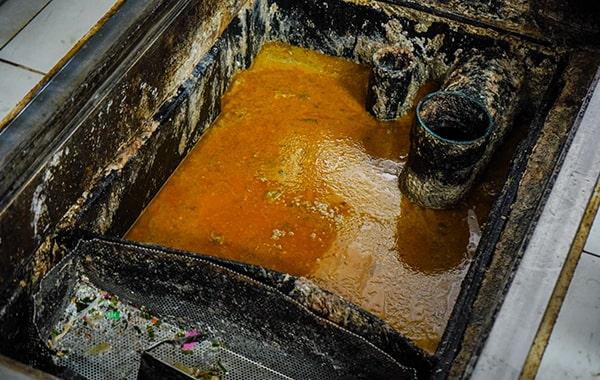 regular grease trap cleaning can prevent costly plumbing issues and reduce the risk of fines, saving you money in the long run